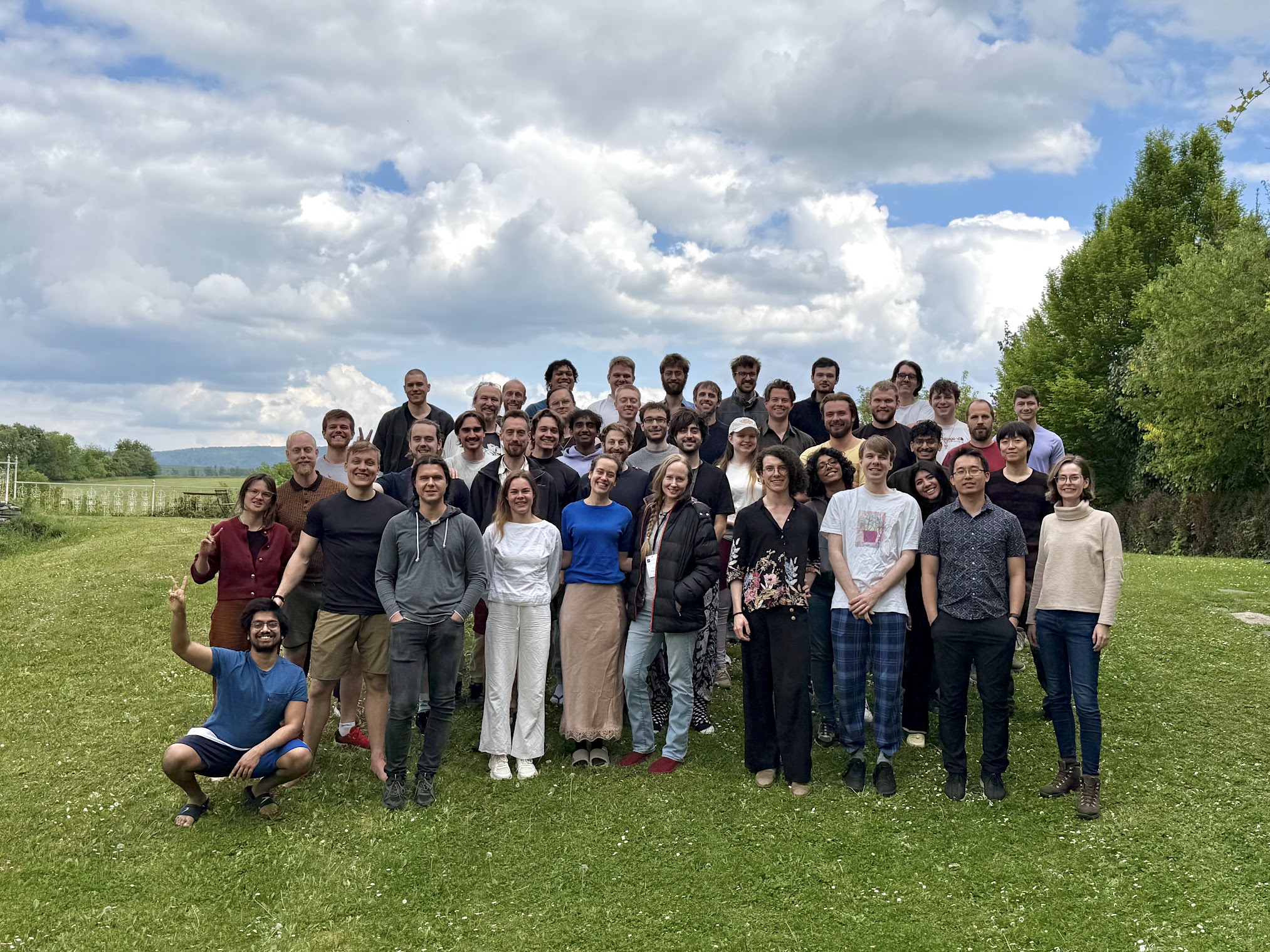 Group photo of the AFFINE seminar cohort on the lawn at Hostačov Ch&acirc;teau